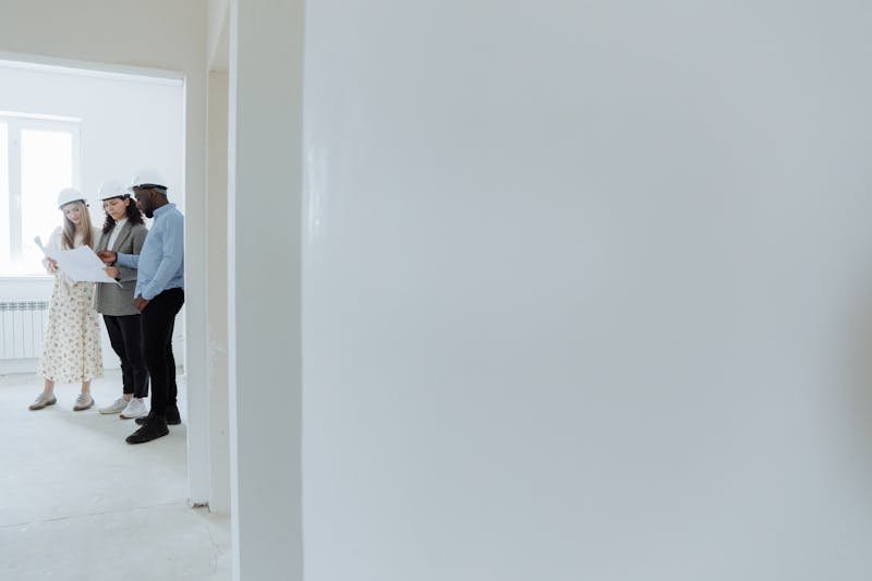 Contractors reviewing blueprints